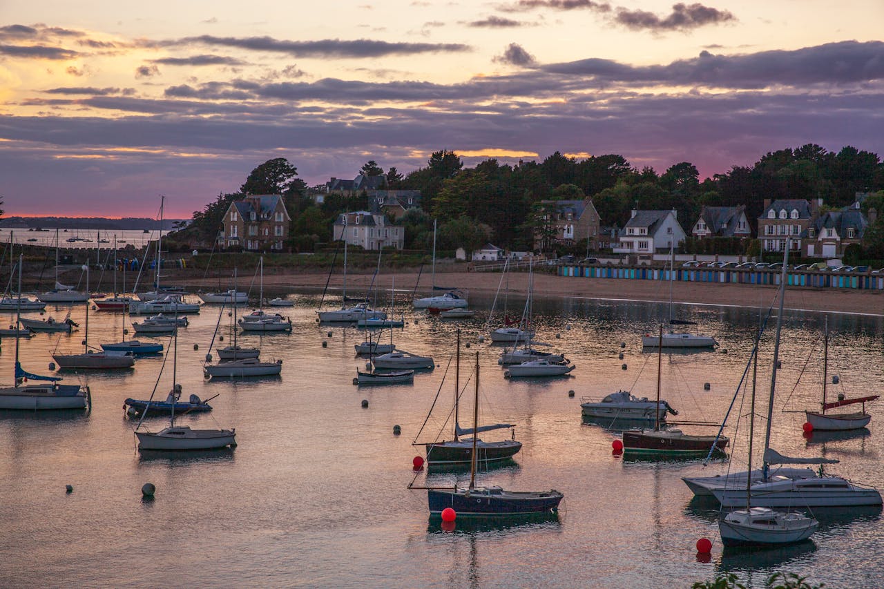 team-01 Beautiful sunset view of sailboats in Saint Briac Sur Mer harbor, Brittany, France.